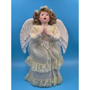 Heaven's Little Angels" porcelain angel tree topper from The Bradford Exchange